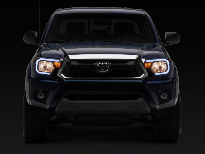 Raxiom for 2012-2015 Toyota Tacoma Axial Series Headlights/Seq LED Bar- Black- Clear Lens