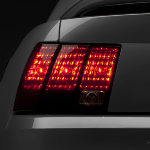 Raxiom for 1999-2004 Ford Mustang Excluding 99-01 Cobra Tail Lights- Black Housing (Smoked Lens)