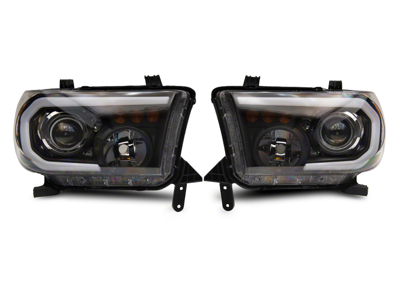 Raxiom for 2007-2013 Toyota Tundra Axial Projector Headlights w/ SEQL LED Bar- Black Housing (Clear Lens)