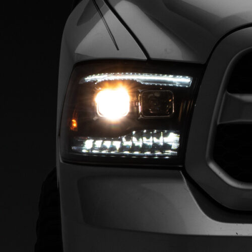 Raxiom for 2009-2018 RAM 1500 LED Projector Headlights w/ Switchback Turn Signals- Blk Housing (Clear Lens)