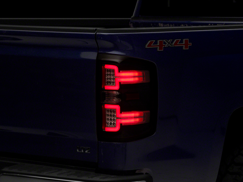 Raxiom for 2014-2018 Chevrolet Silverado 1500 LED Taillights w/ SEQL Turn Signals- Blk Housing (Clear Lens)