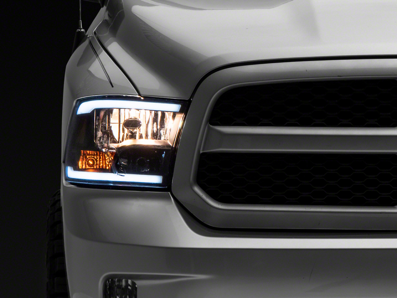 Raxiom for 2009-2018 Dodge RAM 1500/2500/3500 Axial Series Headlights w/ LED Bar- Black Housing (Clear Lens)