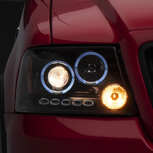 Raxiom for 2004-2008 Ford F-150 Dual LED Halo Projector Headlights- Black Housing (Clear Lens)