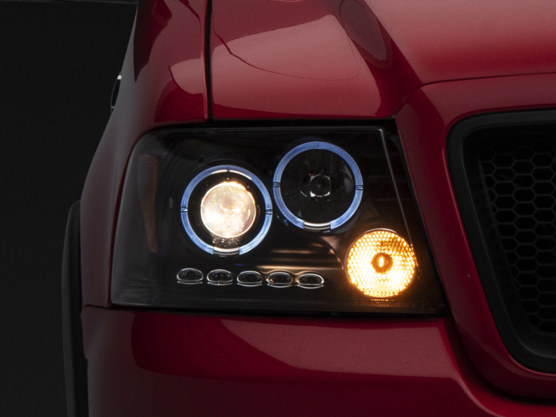 Raxiom for 2004-2008 Ford F-150 Dual LED Halo Projector Headlights- Black Housing (Clear Lens)