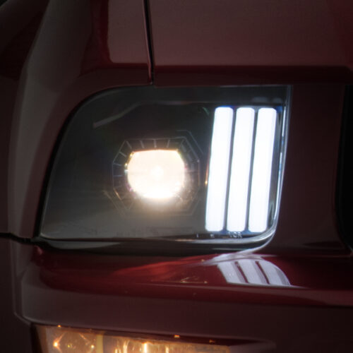 Raxiom for 2005-2009 Ford Mustang w/ Halogen Projector Headlights- Black Housing (Clear Lens) (No GT500 )