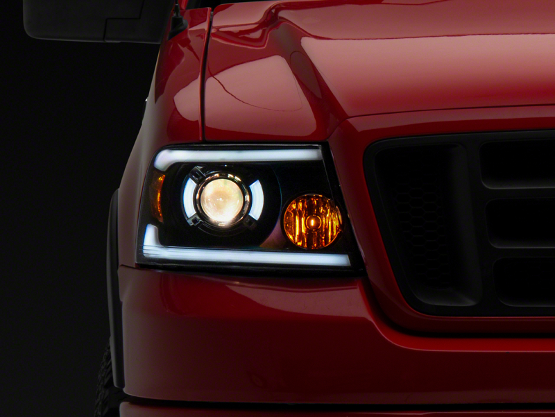 Raxiom for 2004-2008 Ford F-150 Axial Series Projector Headlights w/ SEQL LED Bar- Blk Housing (Clear Lens)