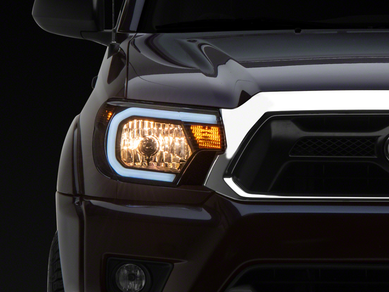 Raxiom for 2012-2015 Toyota Tacoma Axial Series Headlights w/ LED Bar- Black Housing (Clear Lens)