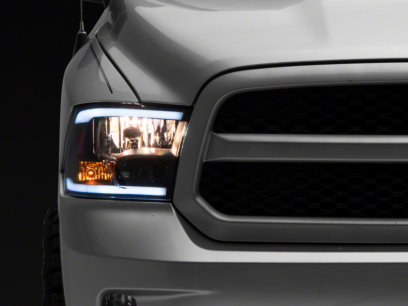 Raxiom for 2009-2018 Dodge RAM 1500/2500/3500 Axial Headlights w/ SEQL LED Bar- Black Housing (Clear Lens)