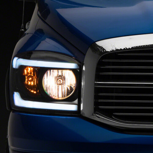 Raxiom for 2006-2009 Dodge RAM 1500/2500/3500 Axial Headlights w/ SEQL LED Bar- Black Housing (Clear Lens)
