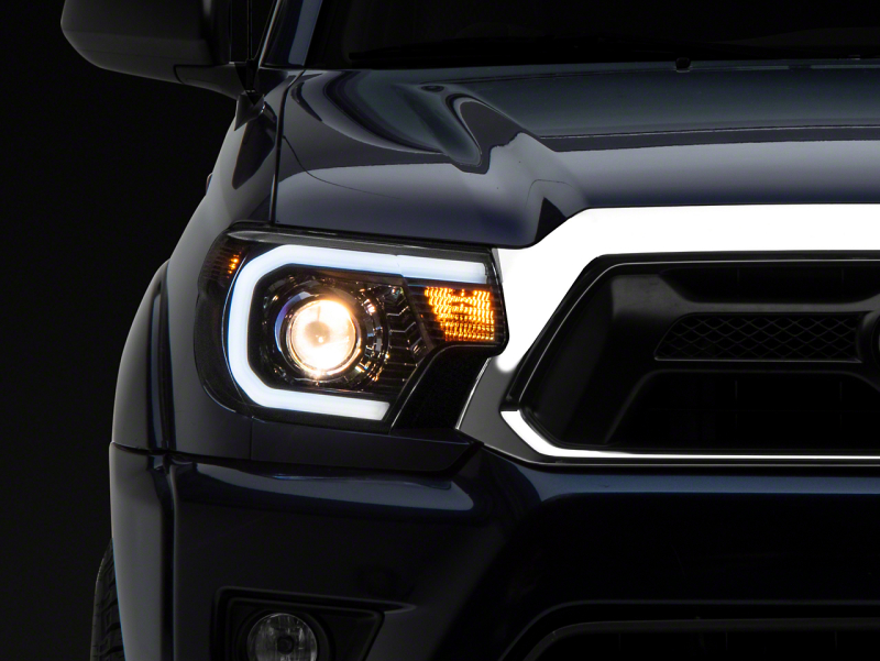 Raxiom for 2012-2015 Toyota Tacoma Axial Series Projector Headlights w/ LED Bar- Black Housing (Clear Lens)